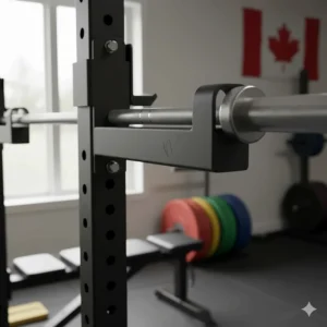 Close-up of adjustable safety spotter arms on a power rack for solo lifting in Canada.