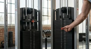 Detailed 4K shot of an ergonomic adjustable pulley system on a professional functional trainer in a Canadian home gym.