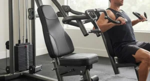 Ergonomic padded seat and multi-position press arms on a commercial-grade single stack home gym.