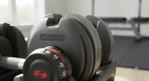 Durable molding around the metal weight plates of Bowflex SelectTech dumbbells designed for quiet, smooth lifts.