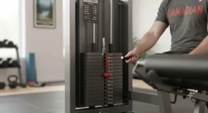 Detailed view of the weight stack and selector pin mechanism on a combo leg workout machine.